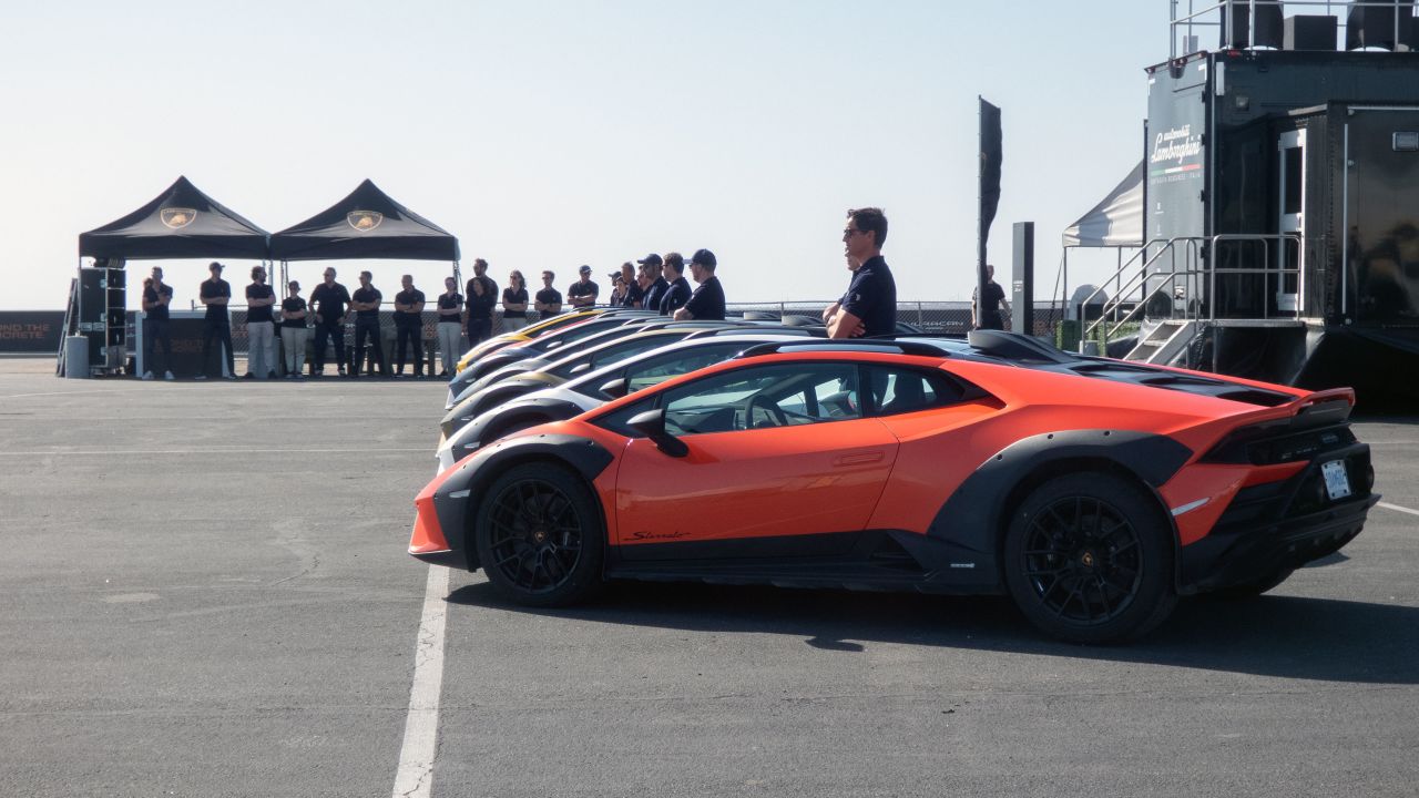 Lamborghini drivers stand next to Lamborghini Haracán Sterratos at Chuckwalla Valley Raceway in Desert Center, Calfiornia.