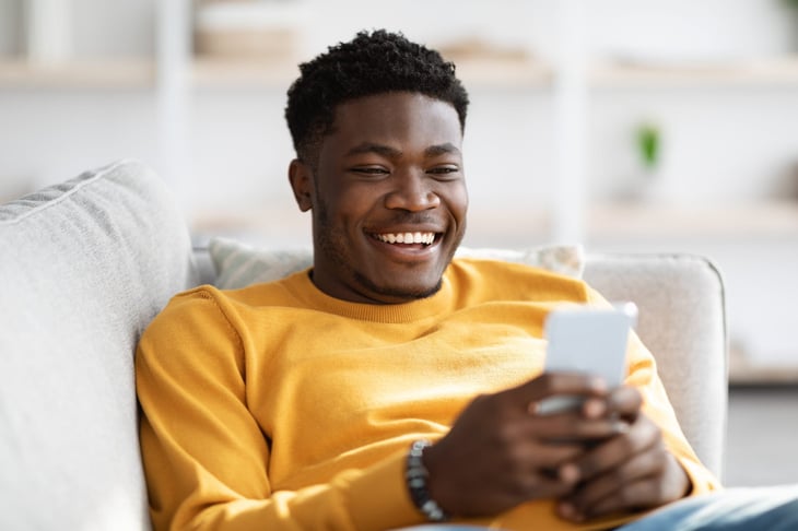 happy man looking at phone
