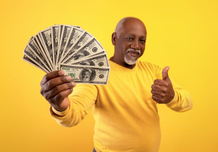 Senior man holding money